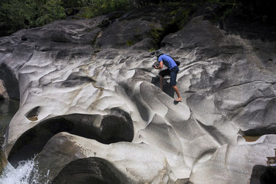 Rear view of man on rock