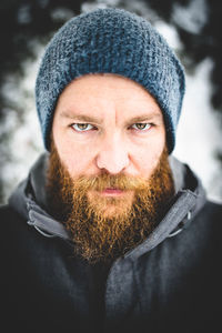 Close-up portrait of man wearing knit hat