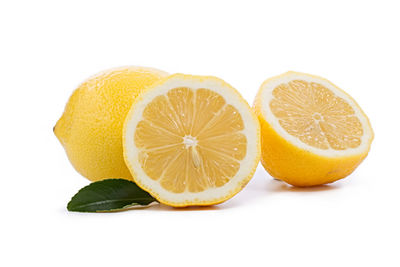 Close-up of orange fruit against white background