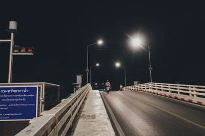 Street lights on road at night