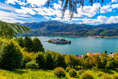 Scenic view of lake and mountains against sky