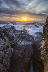 Scenic view of sea against sky during sunset