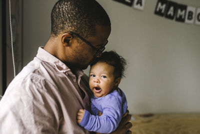 Portrait of mother with baby at home