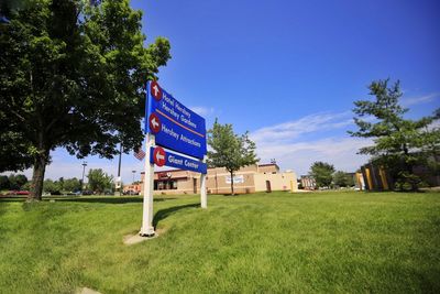 Road sign against blue sky