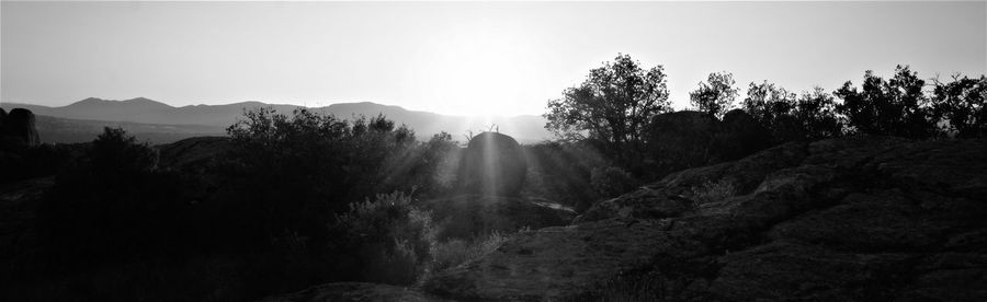 Scenic view of silhouette mountains against clear sky