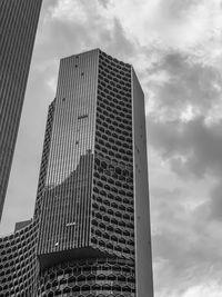 Low angle view of modern buildings against sky in city