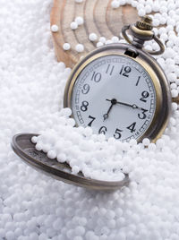 High angle view of clock on table