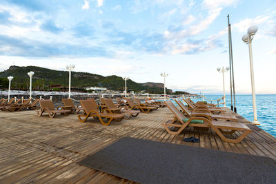 Wooden bungalows with white sun loungers