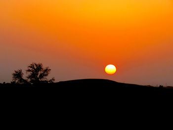 Scenic view of sunset over landscape