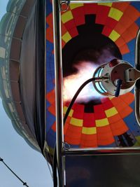 Low angle view of balloons against sky