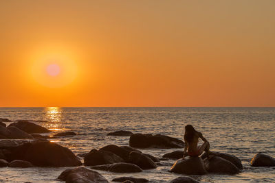 Scenic view of sea at sunset