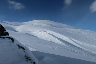 Snow covered mountain against sky