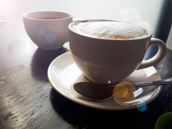 Close-up of coffee cup on table