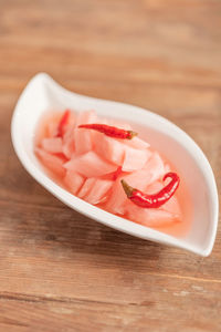 High angle view of chopped fruits in bowl on table