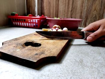 Midsection of person preparing food on table
