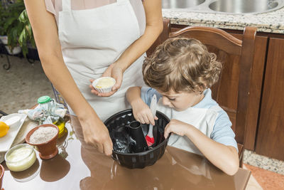 High angle view of boy preparing food