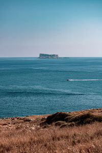 Scenic view of sea against clear sky