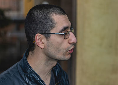 Portrait of young man looking away