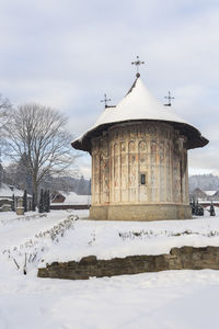 Building against sky during winter