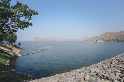 Scenic view of sea against clear blue sky