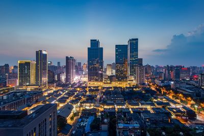 High angle view of illuminated cityscape at night