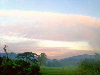 Scenic view of landscape against sky during sunset