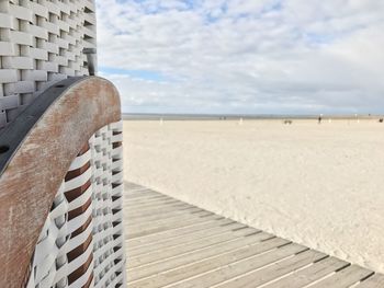 Close-up of beach against sky