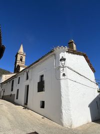 Low angle view of building against clear blue sky