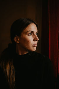 Portrait of young woman looking away