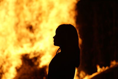 Silhouette of woman at sunset