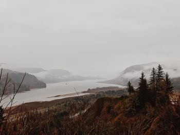 Scenic view of mountains against sky during winter