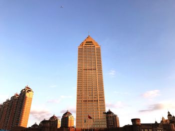 Low angle view of skyscrapers against sky