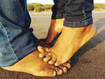 Low section of man standing on floor
