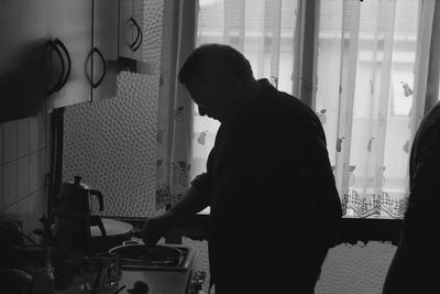 Close-up of man in kitchen