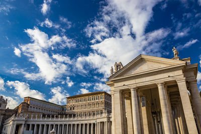 Low angle view of building against cloudy sky