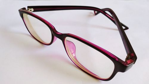 Close-up of eyeglasses on gray background