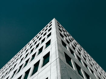 Low angle view of building against clear blue sky