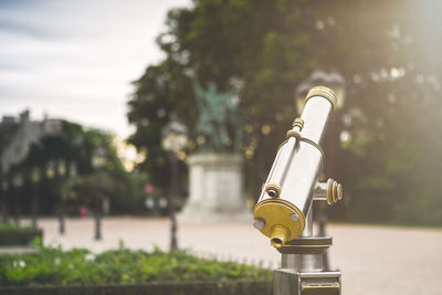 Close-up of hand-held telescope in park