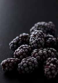 Close-up of blueberries against black background
