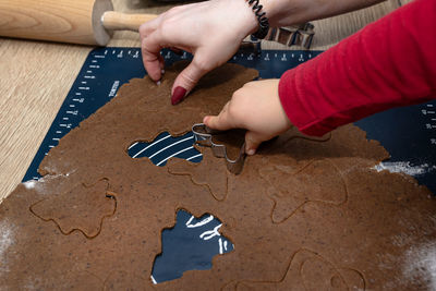 Cropped hand of man holding jigsaw piece