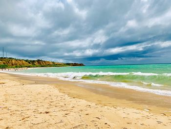 Scenic view of beach against sky