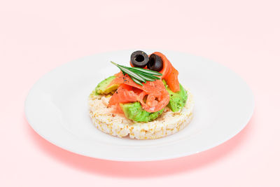 Close-up of food in plate on white background