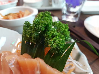 Close-up of fresh salad in plate on table