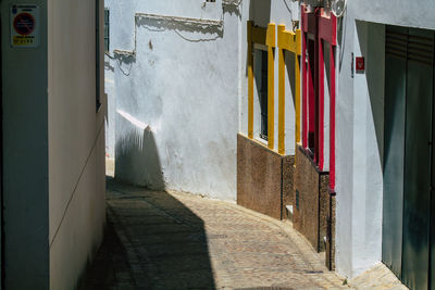 Clothes drying on footpath against building