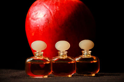 Close-up of apple on table against black background