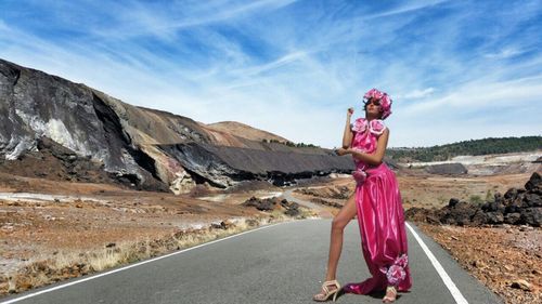 Woman standing on road