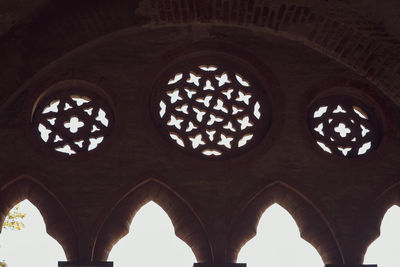Low angle view of ornate window in building