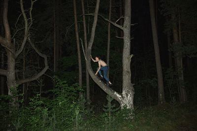 Woman in forest at night