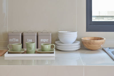 Close-up of tea cups on table