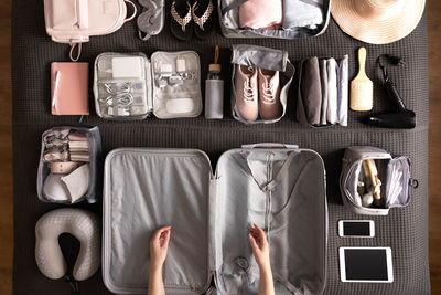 Woman packing suitcase for travelling